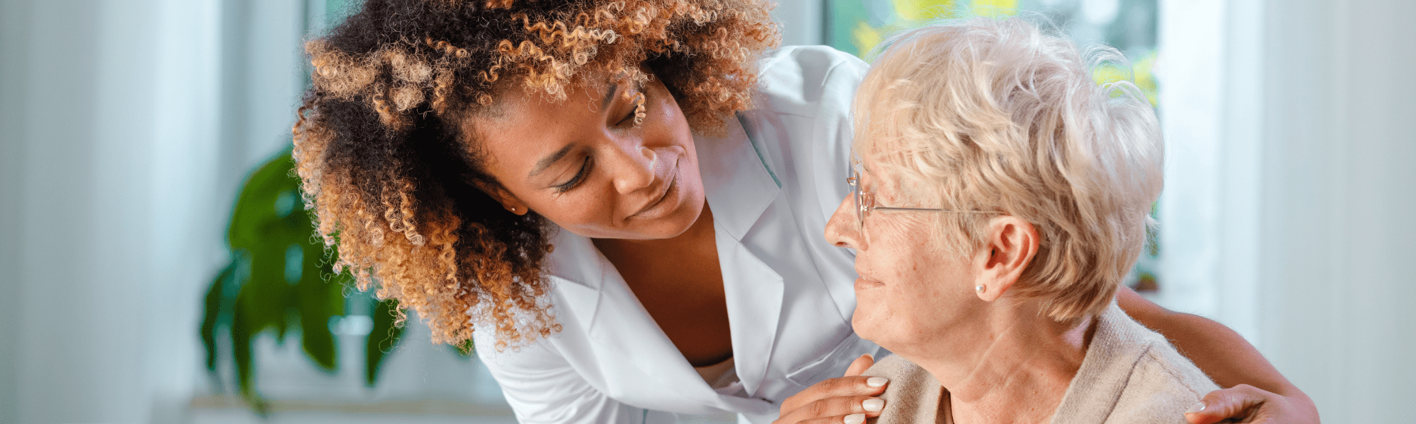 Nurse helping elderly woman